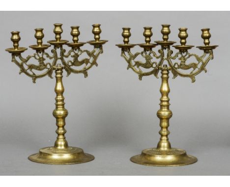 A pair of large turned and cast brass five light candelabra, possibly Russian
45 cm high.  (2) CONDITION REPORTS: Both genera