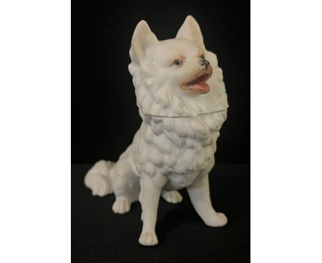 A German Heubach bisque novelty inkewell, in the form of a Spitz, 12.5cm high, impressed mark 