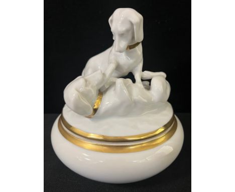 A Striegau novelty powder bowl, the cover surmounted with Dachshunds' playing, in the white, banded in gilt, 15.5cm high, pri