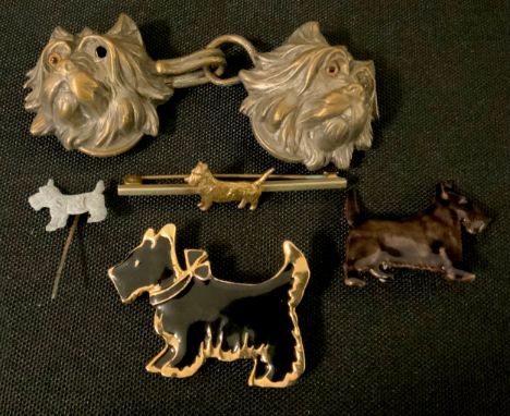 An early 20th century silver plated cloak fastener, as Rough Haired Terriers, glass eyes (one missing), 8.7cm wide;  Kenart e