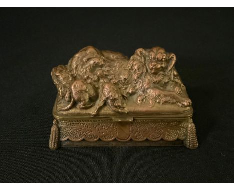 Louis Theophile Hinge (1852 - 1911), French, a copper and brass trinket box, the cover with Toy Spaniel fedding her pups, sig