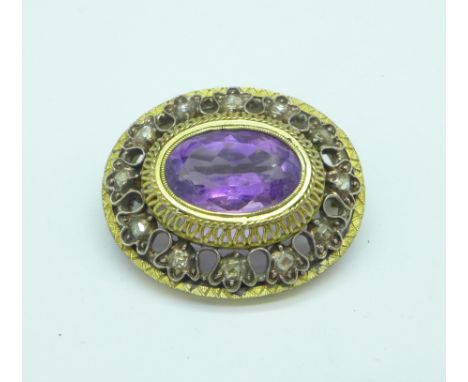 A Georgian gold and silver, amethyst and diamond brooch, 9.2g, 29mm x 25mm, set with twelve old cut diamonds