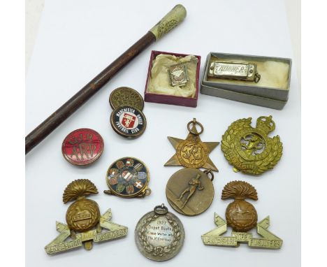 A RAMC swagger stick, badges and medallions