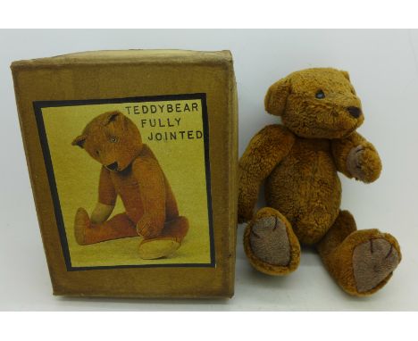 A fully jointed Teddy bear, in original box, 20cm