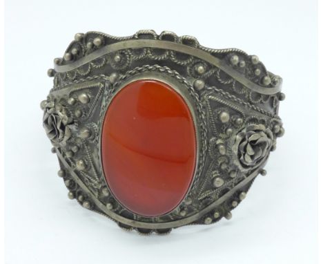 A large carnelian set white metal bangle, 57g