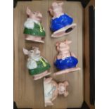 A collection of 5 Wade natwest piggy banks