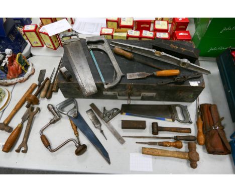 A collection of Woodworking Hand tools including Bull Nose Plane, saws, wet stones, chisels etc 