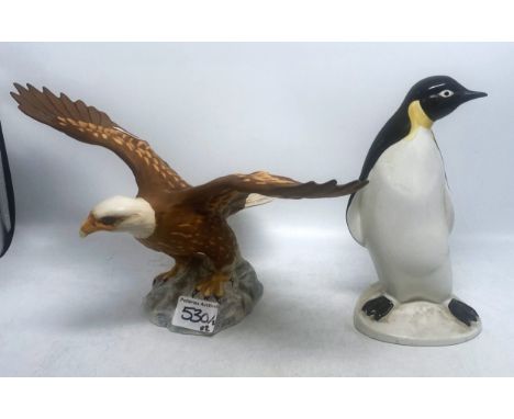 Beswick Matt Bald Eagle 1018 together with Poole pottery figure of a penguin (2) 