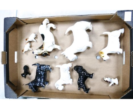 A collection of ceramic dogs to include Wade, Adderley etc ( 1 tray) 
