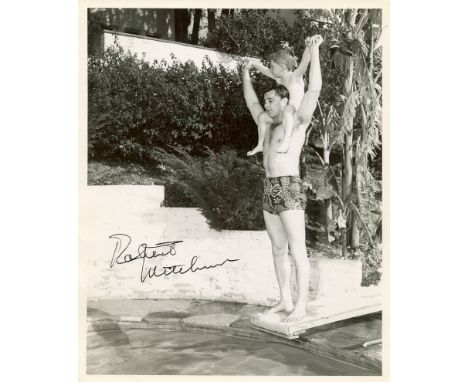 MITCHUM ROBERT: (1917-1997) American film Actor. Vintage signed 8 x 10 photograph by Mitchum, the image showing the American 