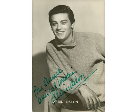 DELON ALAIN: (1935- ) French Actor. Vintage signed and inscribed 4 x 6 photograph, the image depicting a young Delon in a hal