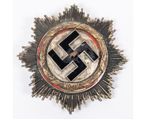 A Third Reich German Cross, gilt wreath, marked on reverse "Ob FW Ulrich Mundt 5/St G.1. 9.4.42", GC (swastika enamel chipped