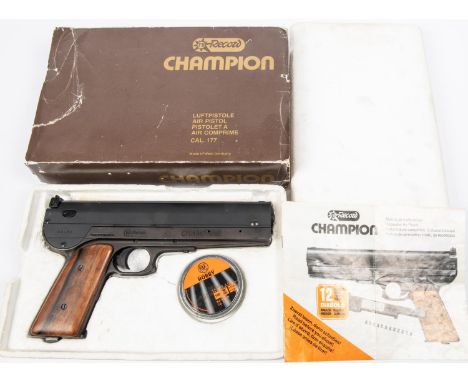 A .177" Record Champion side lever air pistol, number 00450, with matt black finish and plain walnut grips. GWO &amp; as New 