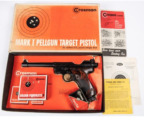 A .22" Crosman Mark I Pellgun CO2 target pistol, number 668401, with mottled brown plastic grips. GC; in its original carton 