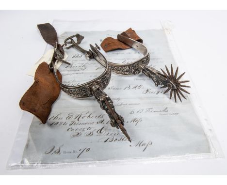 A pair of historically interesting mid 19th century Mexican silver spurs, with deeply embossed foliate decoration and multi s