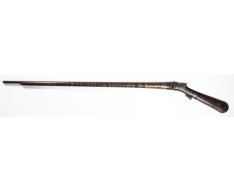 A good Indian matchlock jezail, 60" overall, octagonal barrel 46", the action having iron sideplates, wood fullstock with lon