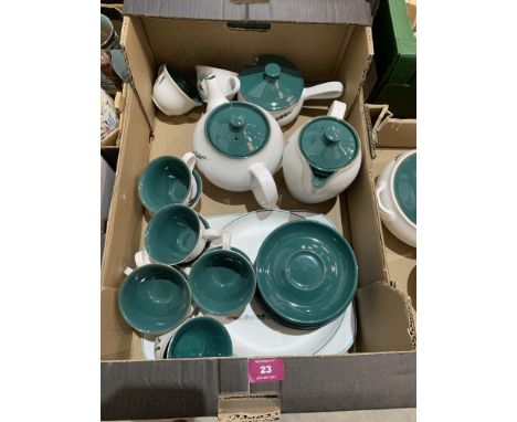 Forty pieces of Denby Greenwheat tableware to include 12 cups and saucers, jugs, coffee and teapots etc.