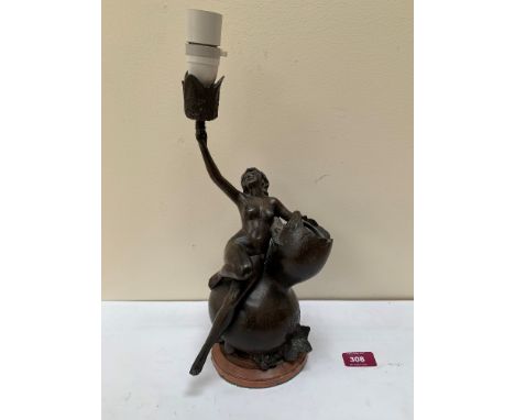 A bronzed speltar figural table lamp after J. Garnier. 12' high