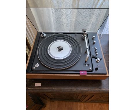 A Bang Olufsen Beogram 1500 record player with a pair of Wharfdale speakers