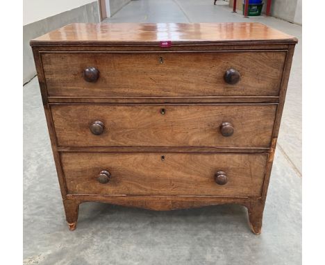 A George III mahogany chest of three long drawers raised on bracket feet. 36' wide. Distressed