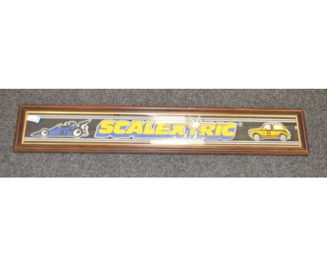 1970's Scalextric shop-display sign. Framed and glazed. PLEASE NOTE WE CANNOT SHIP THIS ITEM DUE TO THE GLASS. 19cm x 107cm a