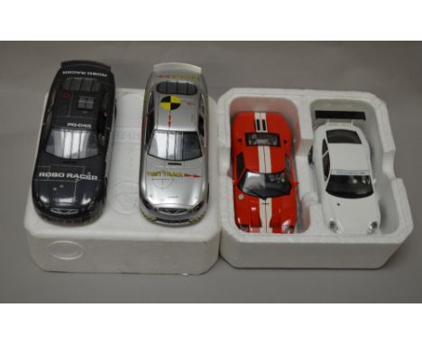 Four unboxed Scalextric cars including two NASCAR models. (4)