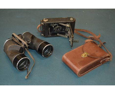 A pair of American Bausch and Comb military binoculars; a Kodak camera