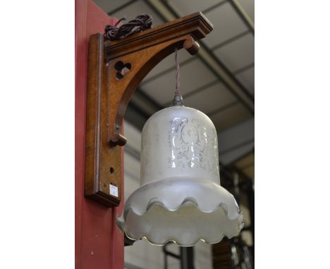 Gothic revival oak wall lamp with etched glass shade