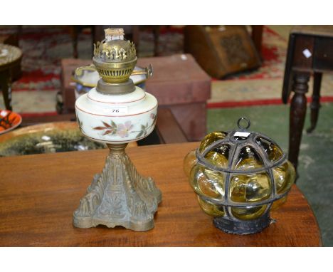 A Victorian oil lamp, with opaline glass bowl; a bulbous glass wall lamp (2)