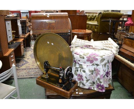 A Singer sewing machine (cased); a pouffe; a folding brass top table; an inlaid occasional table (4)