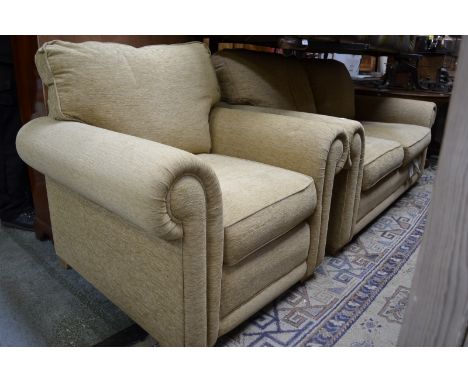 A contemporary two seat sofa and conforming armchair.