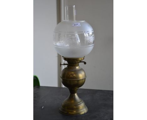 A Victorian oil lamp decorated with floral design 