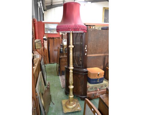 A gilt standard lamp, turned fluted column.