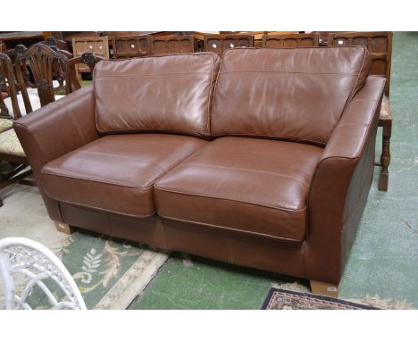 A modern designer two seat leather sofa