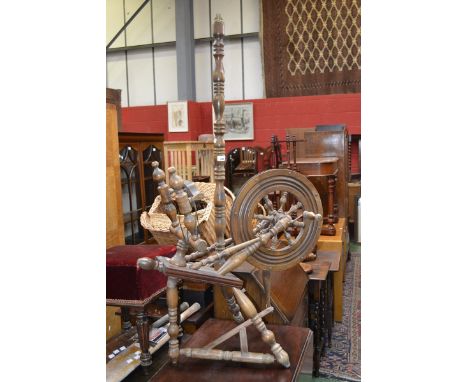 An oak spinning wheel converted to a standard lamp