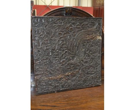 A carved oak panel and a walnut tapestry hanger  