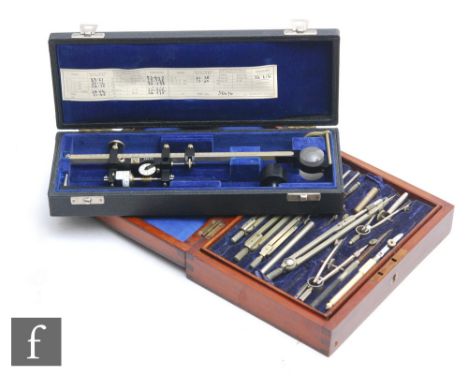 An Air Ministry mahogany cased set of drawing instruments inset with a brass plaque dated 1939, width 20cm, and a Vernier sca