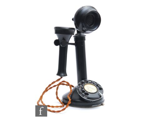 A GEC style black painted candlestick telephone with adjustable speaker, height 30cm.