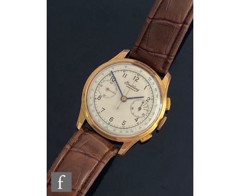 An 18ct Breitling Premier chronograph wrist watch with Arabic numerals and twin subsidiary dials to a silvered circular dial,