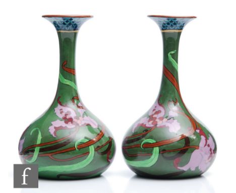 A pair of early 20th Century Foley (Wileman &amp; Co) Art Nouveau Intarsio bottle vases each decorated with a stylised purple