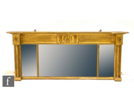 A 19th Century over mantel mirror, the inverted breakfront top over a triple plate centred with a floral panel and flanked by