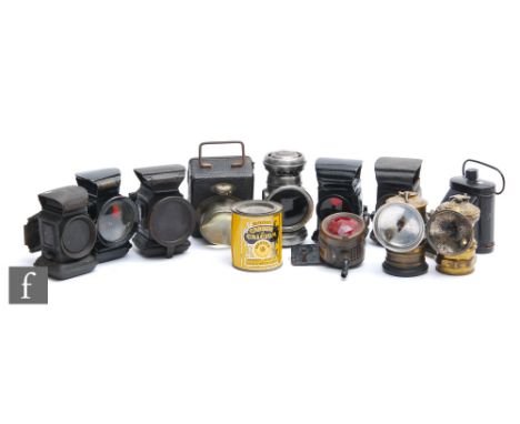 A collection of ten early 20th Century black painted cycle lamps including a battery operated lamp, examples to include F&amp
