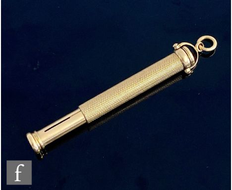 An early 20th Century retractable dip pen and pencil combination with 9ct engine turned decorated sleeve terminating in an in
