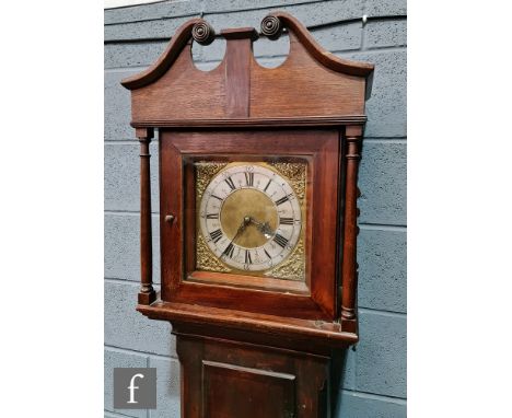 A 19th Century oak and mahogany crossbanded longcase clock, the brass dial with pierced spandrels and silvered chapter ring, 