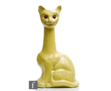 A large early 20th Century novelty vase modelled as a cat with an elongated neck and glazed in yellow with glass eyes, printe