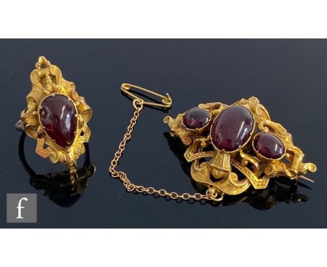 A 19th Century 15ct oval brooch with three foil back red stones and plaited hair panel to reverse, with a matching single ear