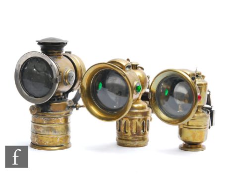 A 1920s Regalite brass cycle lamp, height 17cm, a similar Panthar brass cycle lamp and another cycle lamp marked HC with moun