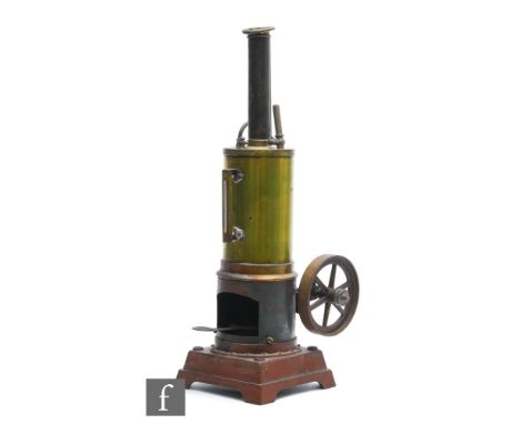 A 1920s German vertical steam engine with brass boiler and chimney, single oscillating flywheel, on red lined painted plinth 