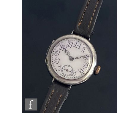 An early 20th Century silver Rolex wrist watch, Arabic numerals to a white enamelled dial, case diameter 34mm, movement marke