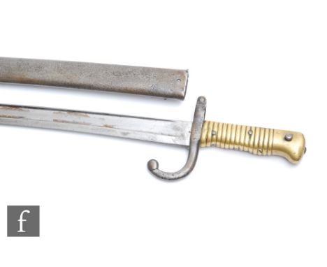 A late 19th Century French chassepot bayonet engraved and dated 1871 with scabbard, length 71cm. 